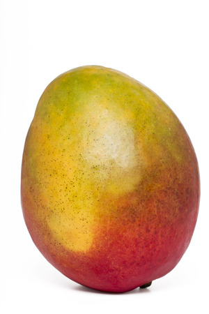 Close up view of a tasty mango fruit isolated on a white background.の写真素材