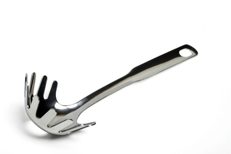 Close up view of a spaghetti  fork isolated on a white background.の写真素材