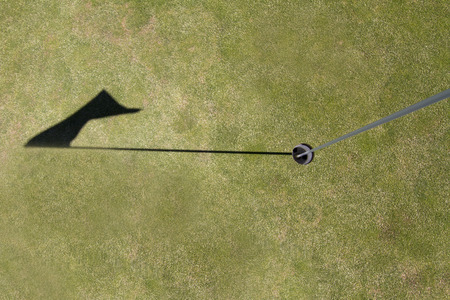 Close up of a flag golf hole view on a golf course.の写真素材