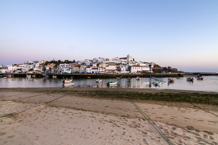 Landscape view of the beautiful coastal village, Ferragudo, located in the Algarve, Portugal.の写真素材