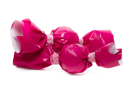 Close up view of two pink and round colorful candies isolated on a white background.の写真素材