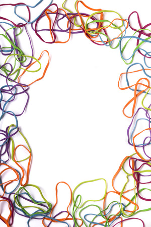 Close up view of several colorful office rubber bands forming a rectangle isolated on a white background.の写真素材