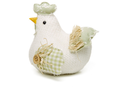 Close up view of a handmade chicken doll isolated on a white background.の写真素材