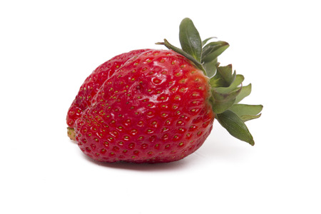 Close up view of a fresh strawberry isolated on a white background.の写真素材