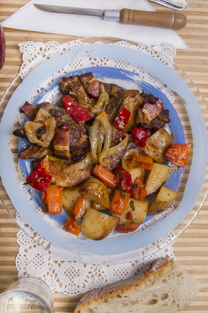 Close up view of oven baked meat with potatoes.の写真素材