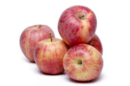 Close up view of some red apples isolated on a white background.の写真素材