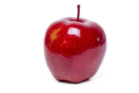Close up view of a single red apple isolated on a white background.の写真素材