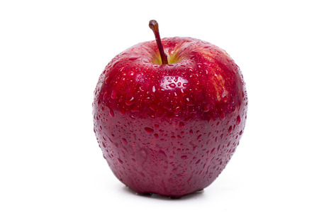 Close up view of a single red apple isolated on a white background.の写真素材