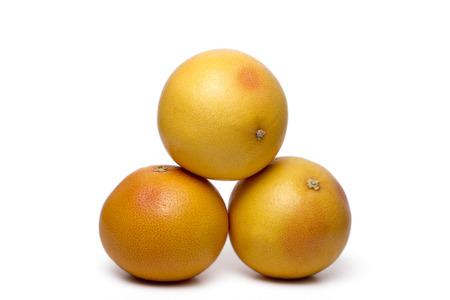 Close up view of a fresh and healthy grapefruits isolated on a white background.の写真素材
