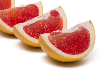 Close up view of a fresh and healthy grapefruit isolated on a white background.の写真素材