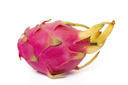 Close up view of an exotic dragon fruit isolated on a white background.の写真素材