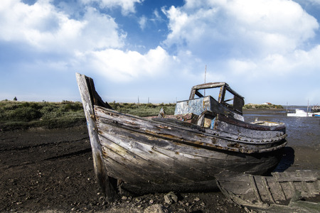 View of an old abandoned fishing boat on the marshlands.の写真素材
