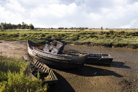 View of an old abandoned fishing boat on the marshlands.の写真素材