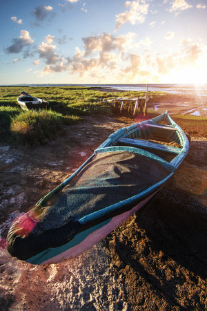 View of an old abandoned fishing boat on the marshlands.の写真素材