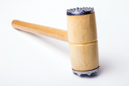 Close up view of a meat hammer isolated on a white .の写真素材