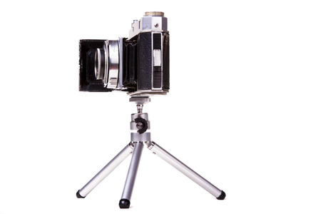 Close up view of a retro vintage photographic camera isolated on a white background.の写真素材