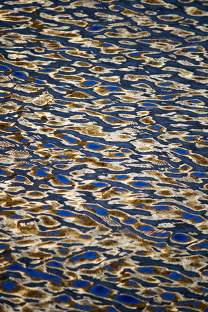 View of a texture of golden water.の写真素材