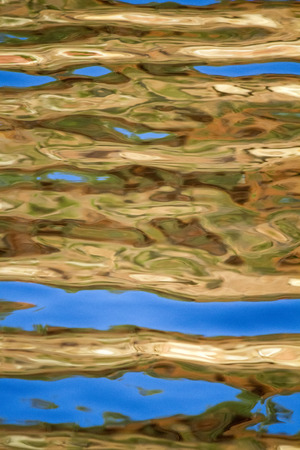 View of a texture of golden water.の写真素材