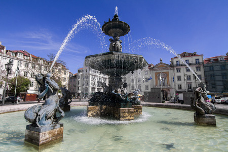 View of the beautiful center fountain in the Rossio square located in Lisbon, Portugal.のeditorial素材