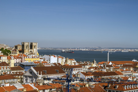 View of the beautiful Lisbon downtown area with landmark Church of Se on top of the hill.の写真素材