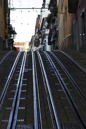 View of the famous street of the Bica lift for the yellow electrical trams, located in Lisbon, Portugal.のeditorial素材