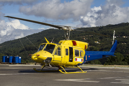 Close up view of a fire fighter helicopter parked.