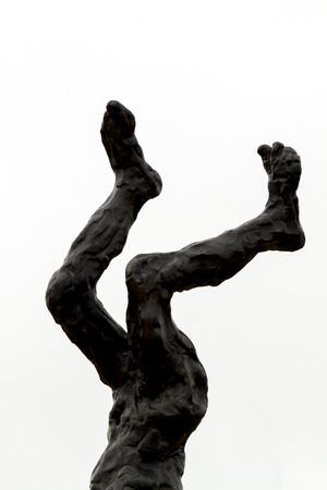 Close up view of an artistic and conceptual piece of art depicting a man's body upside down.の写真素材