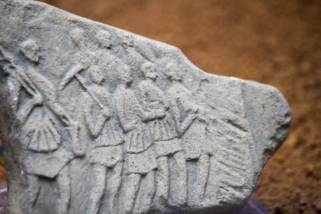 Close up view of ancient Roman artistic stone remains in a museum.