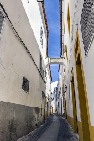 View of a typical street of the Alentejo region villages, this one is from Evora city, Portugal.の写真素材