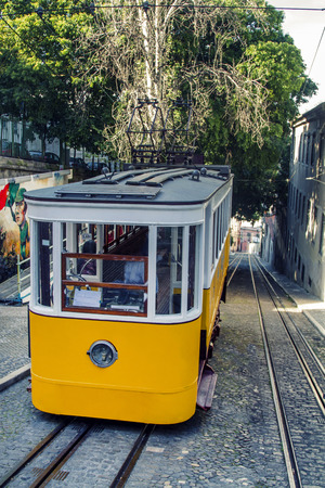 View of the famous lift of vintage electric tram of Gloria, located in Lisbon, Portugal.の写真素材