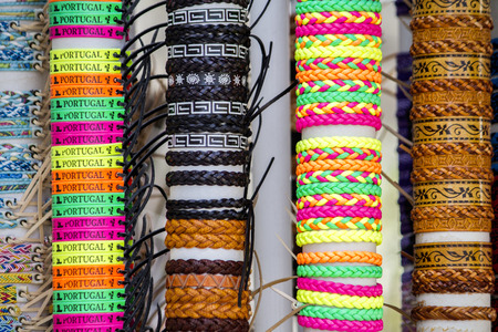 Close up view of many various leather and textile bracelets.の写真素材