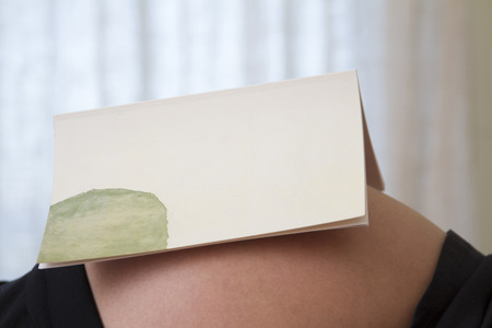 Close up view of the belly of a expecting pregnant woman.の写真素材