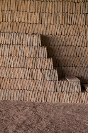 Close view of a pile of traditional mud bricks production.の写真素材