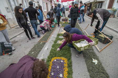 SAO BRAS DE ALPORTEL, PORTUGAL - April, 2015: Traditional religious procession of the flower torches event located in village of Sao Bras de Alportel, Portugal.のeditorial素材