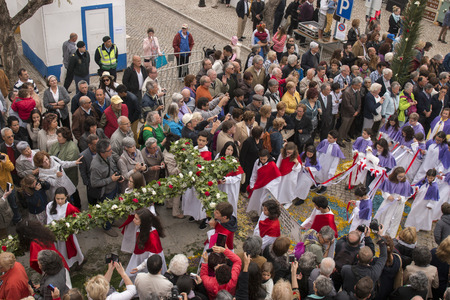 SAO BRAS DE ALPORTEL, PORTUGAL - April, 2015: Traditional religious procession of the flower torches event located in village of Sao Bras de Alportel, Portugal.のeditorial素材