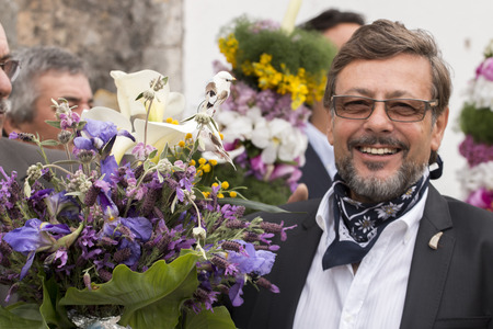 SAO BRAS DE ALPORTEL, PORTUGAL - April, 2015: Traditional religious procession of the flower torches event located in village of Sao Bras de Alportel, Portugal.のeditorial素材