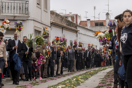 SAO BRAS DE ALPORTEL, PORTUGAL - April, 2015: Traditional religious procession of the flower torches event located in village of Sao Bras de Alportel, Portugal.のeditorial素材