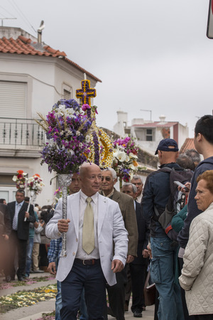 SAO BRAS DE ALPORTEL, PORTUGAL - April, 2015: Traditional religious procession of the flower torches event located in village of Sao Bras de Alportel, Portugal.のeditorial素材