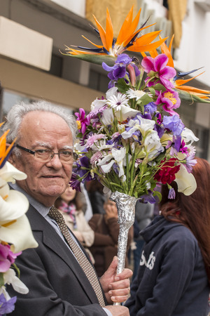 SAO BRAS DE ALPORTEL, PORTUGAL - April, 2015: Traditional religious procession of the flower torches event located in village of Sao Bras de Alportel, Portugal.のeditorial素材