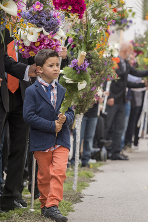SAO BRAS DE ALPORTEL, PORTUGAL - April, 2015: Traditional religious procession of the flower torches event located in village of Sao Bras de Alportel, Portugal.のeditorial素材