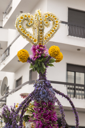 SAO BRAS DE ALPORTEL, PORTUGAL - April, 2015: Traditional religious procession of the flower torches event located in village of Sao Bras de Alportel, Portugal.のeditorial素材