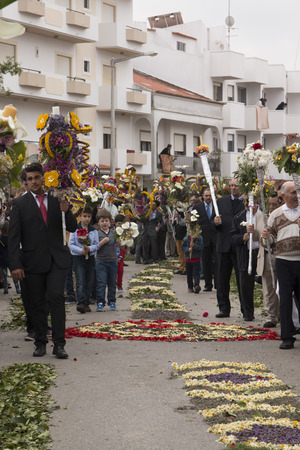 SAO BRAS DE ALPORTEL, PORTUGAL - April, 2015: Traditional religious procession of the flower torches event located in village of Sao Bras de Alportel, Portugal.のeditorial素材