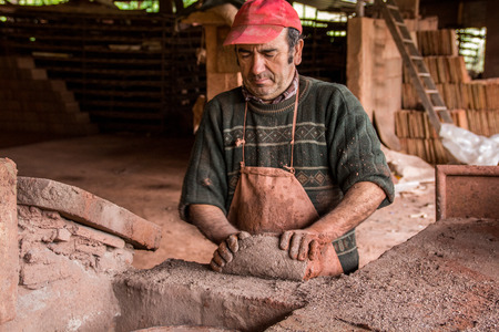 SAO BRAS DE ALPORTEL, PORTUGAL - April, 2015: View of a bed of traditional mud brick production factory.のeditorial素材
