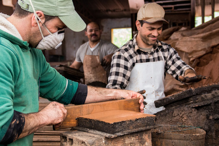 SAO BRAS DE ALPORTEL, PORTUGAL - April, 2015: View of a bed of traditional mud brick production factory.のeditorial素材