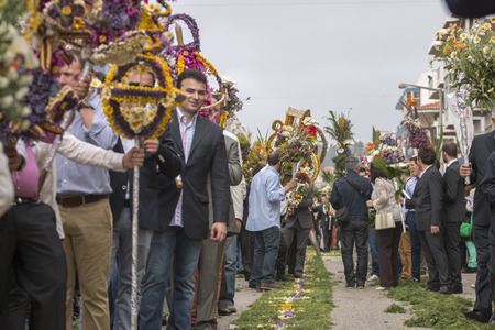 SAO BRAS DE ALPORTEL, PORTUGAL - April, 2015: Traditional religious procession of the flower torches event located in village of Sao Bras de Alportel, Portugal.のeditorial素材