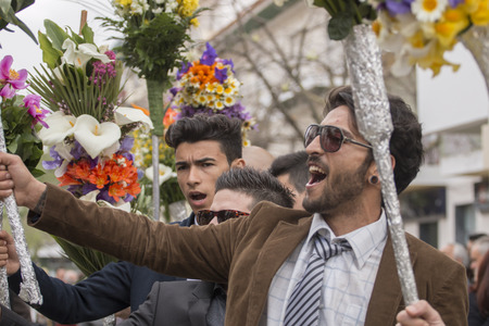 SAO BRAS DE ALPORTEL, PORTUGAL - April, 2015: Traditional religious procession of the flower torches event located in village of Sao Bras de Alportel, Portugal.のeditorial素材