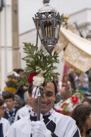 SAO BRAS DE ALPORTEL, PORTUGAL - April, 2015: Traditional religious procession of the flower torches event located in village of Sao Bras de Alportel, Portugal.のeditorial素材