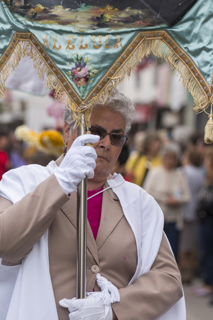 SAO BRAS DE ALPORTEL, PORTUGAL - April, 2015: Traditional religious procession of the flower torches event located in village of Sao Bras de Alportel, Portugal.のeditorial素材