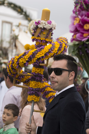 SAO BRAS DE ALPORTEL, PORTUGAL - April, 2015: Traditional religious procession of the flower torches event located in village of Sao Bras de Alportel, Portugal.のeditorial素材
