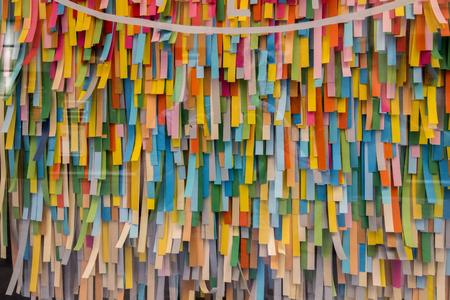 Close up view of many different colorful stripes of paper.の写真素材